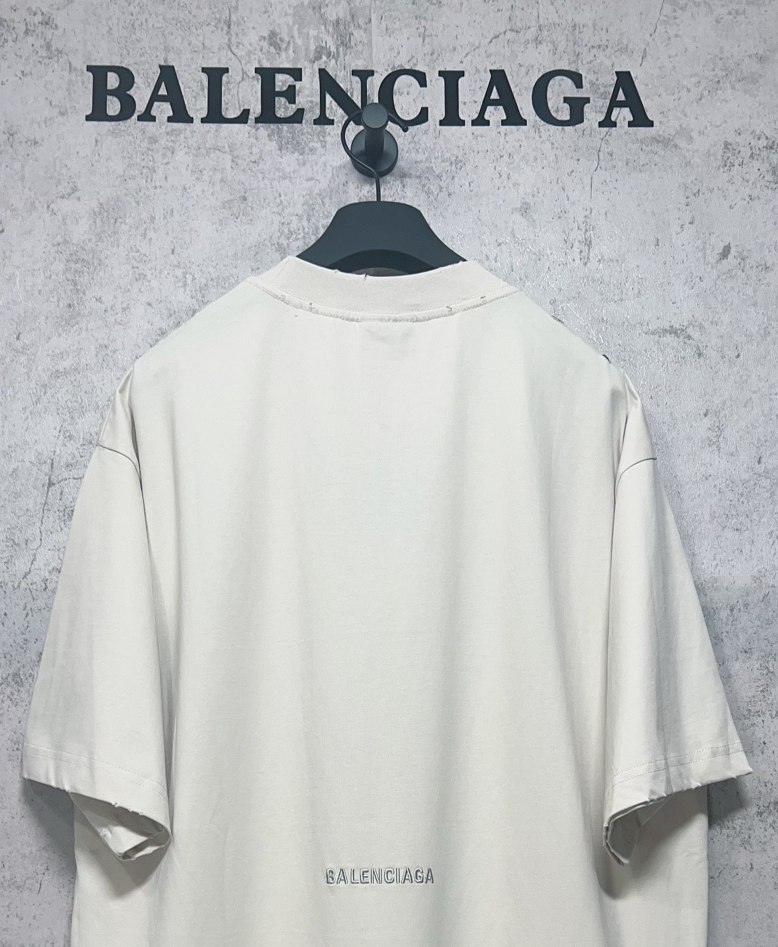 White short-sleeve T-shirt back with Balenciaga logo print near the hem