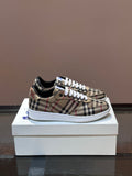 Checkered low-top sneakers with white laces and blue accent, rubber sole