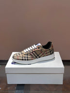 Checkered low-top sneakers, white laces, blue sole accent on white box
