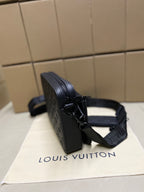 Men's Louis Vuitton crossbody bag, dark blue, side profile with adjustable shoulder strap