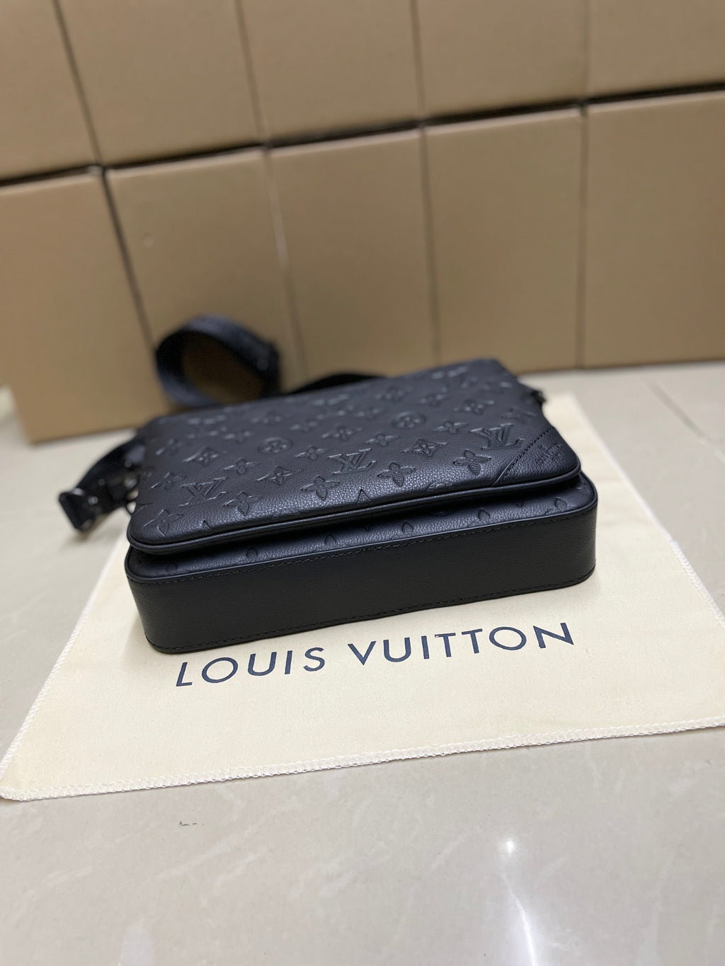 Men's Louis Vuitton crossbody bag, dark blue monogram, compact silhouette with shoulder strap