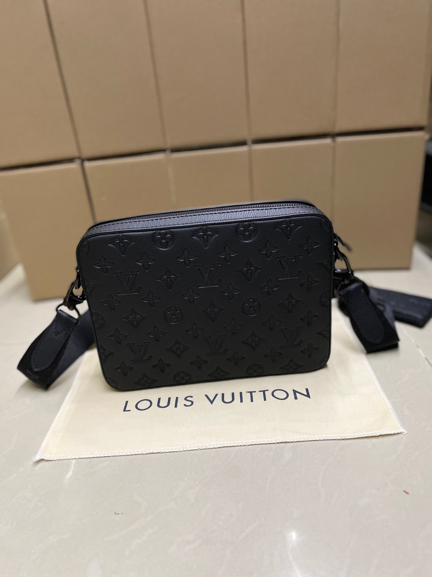 Men's Louis Vuitton crossbody bag, dark blue monogram pattern, front zip and side strap