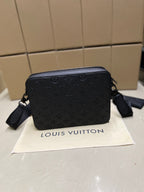 Louis Vuitton monogram crossbody bag, black, front view with zip closure