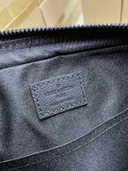 Men's Louis Vuitton crossbody bag close-up, dark blue fabric texture and stitched label