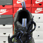 Unisex running shoe collar close-up with black knit, blue striped pull tab, neon green details.