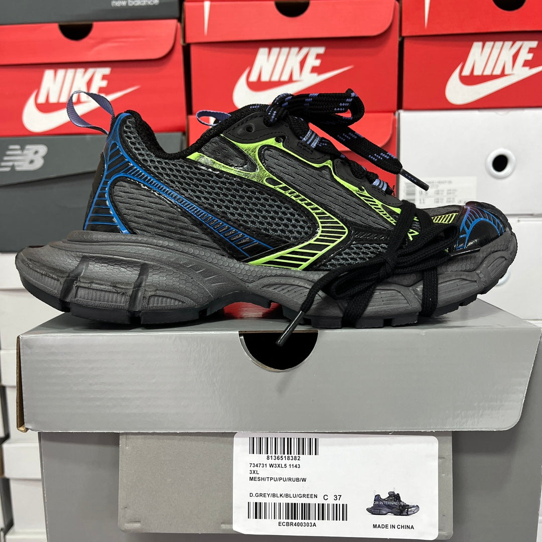 Unisex lace-up running shoe in black and gray with neon green trim and blue side detail.