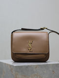 Tan leather crossbody bag with gold YSL logo on front flap