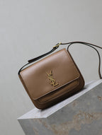 Tan leather shoulder bag with front flap and gold YSL logo detail