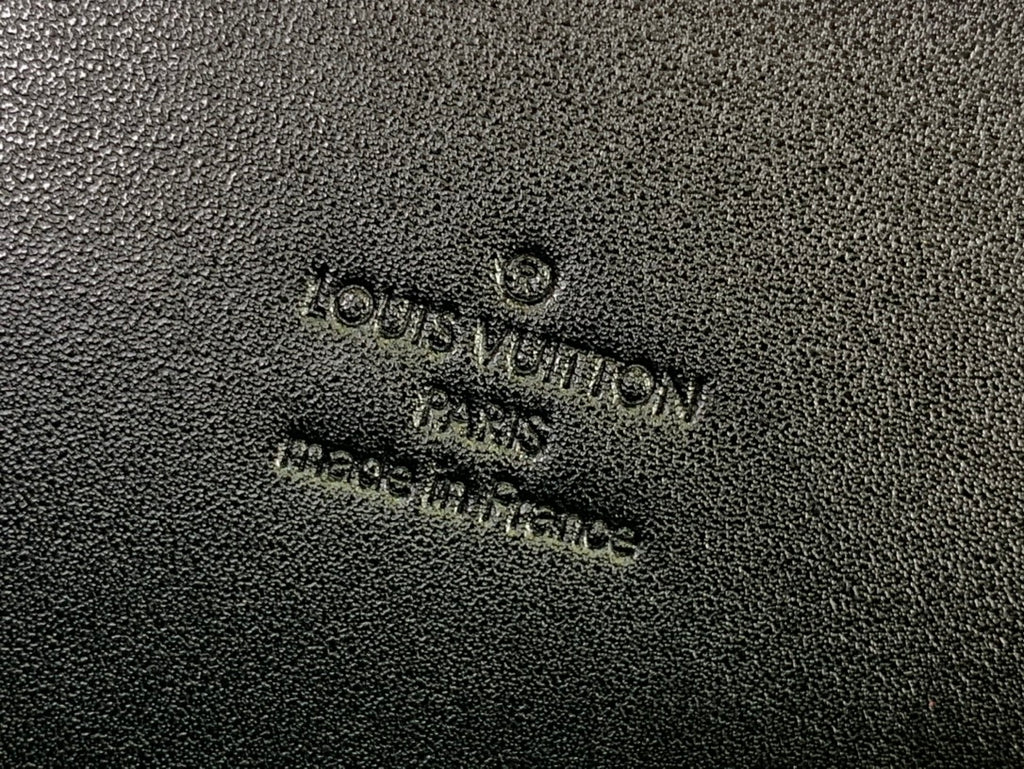 Men's Louis Vuitton bag embossed logo text on textured black fabric