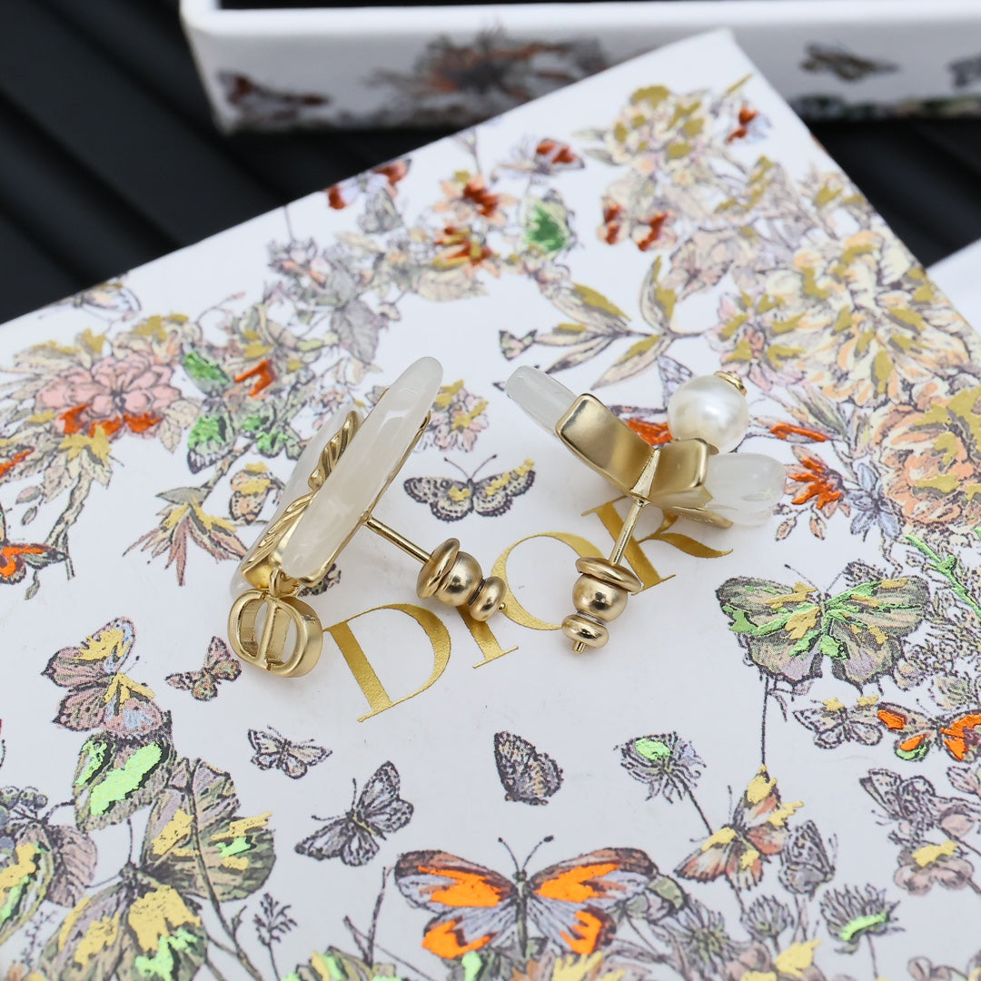 Gold-tone butterfly ear accessories with faux pearls and Dior logo detailing