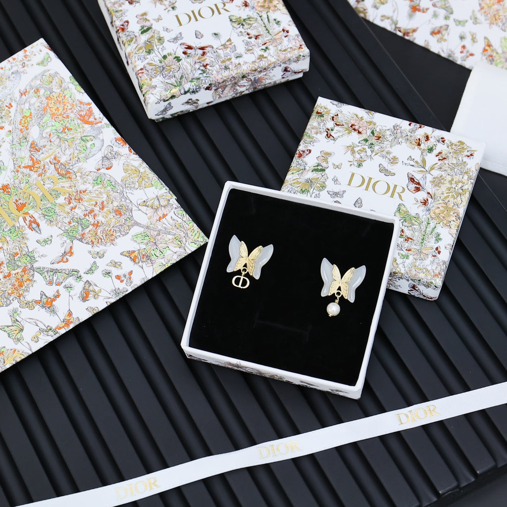 Butterfly earrings with faux pearl and gold-tone Dior logo drop charm