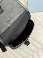 Prada black mini bag side panel with stitched trim and strap attachment