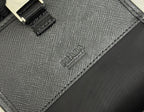Prada bag close-up of textured panel stitching and embossed PRADA logo