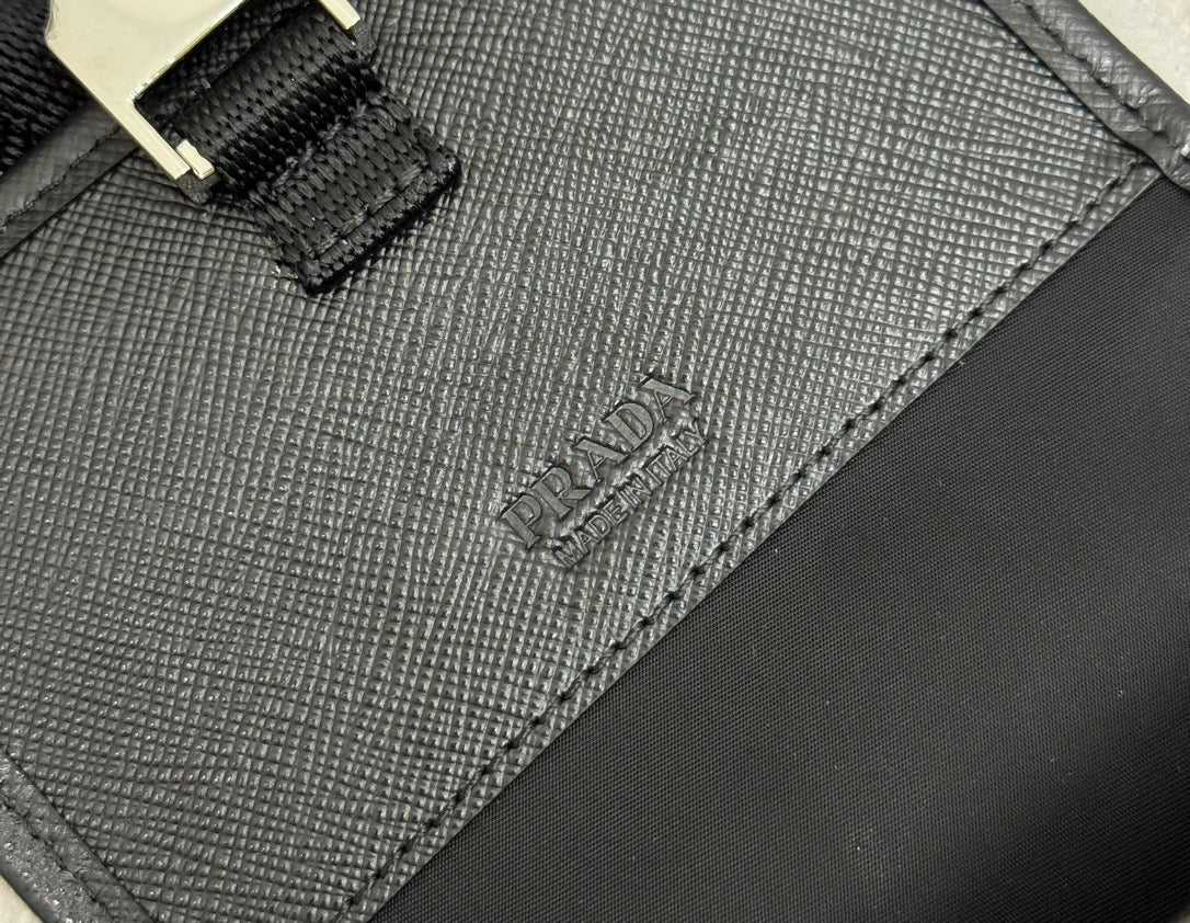 Prada bag close-up of textured panel stitching and embossed PRADA logo