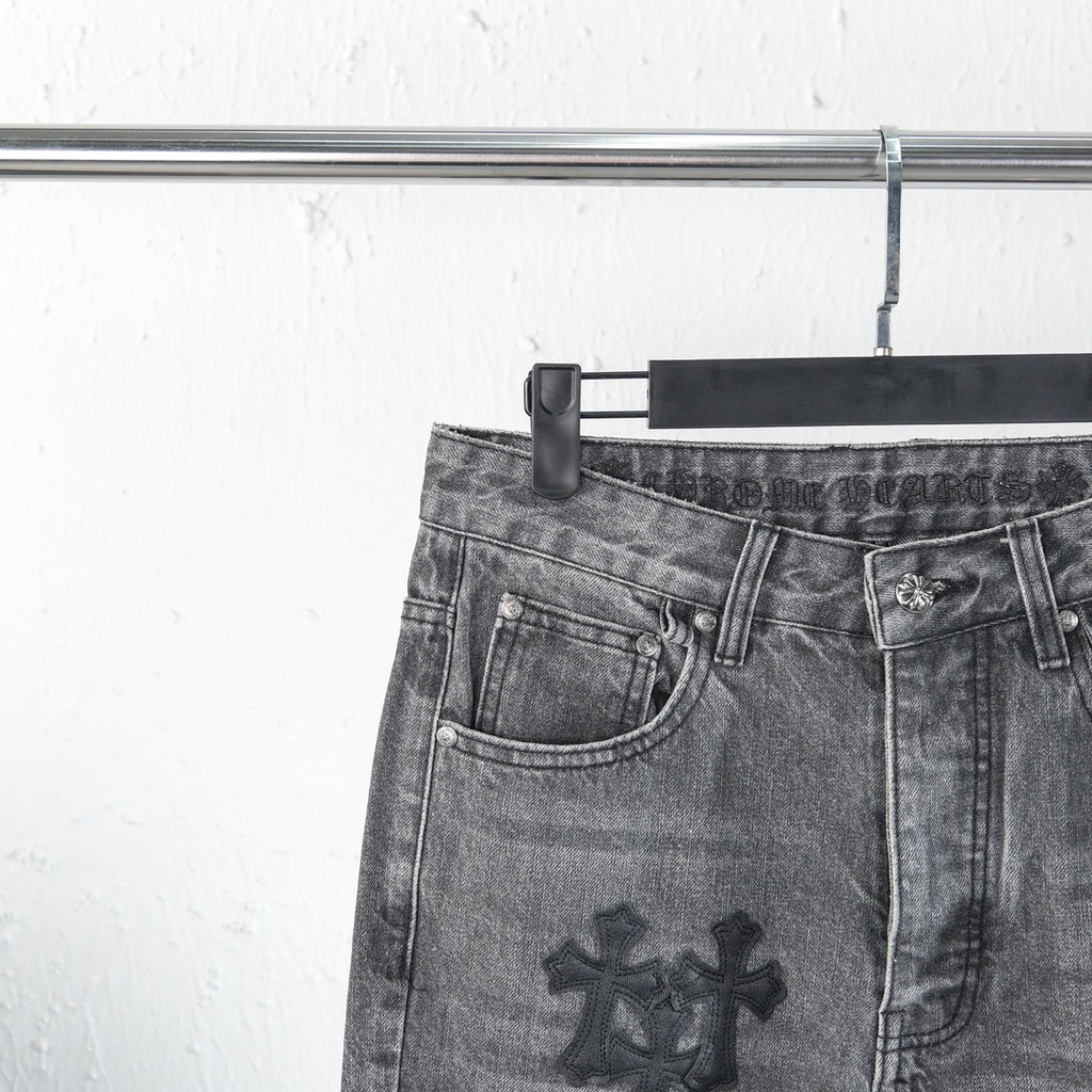 Chrome pants front waist close-up with side pockets and cross patch on leg