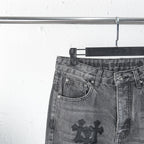 Chrome pants front waist close-up with side pockets and cross patch on leg