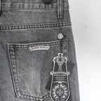 Gray denim pants with front pocket and crest logo detail