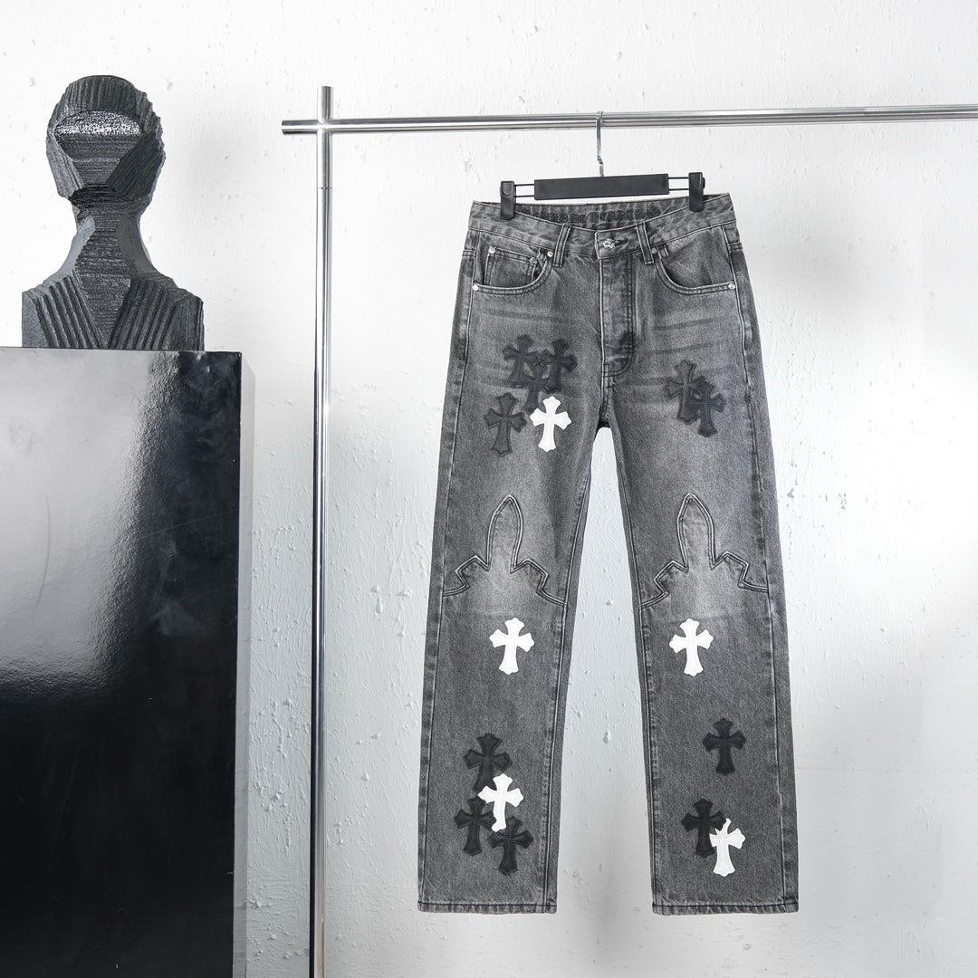 Chrome pants in dark gray denim with cross graphic patches on the legs