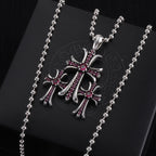 Pendant necklace with chrome cross charm and red/purple enamel, on card