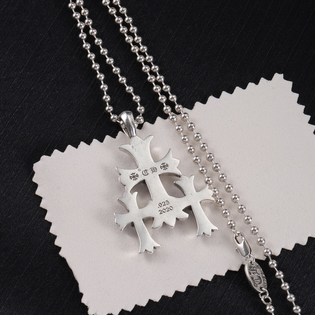 Chrome pendant necklace with snowflake-like charm, engraved 925 and 2020