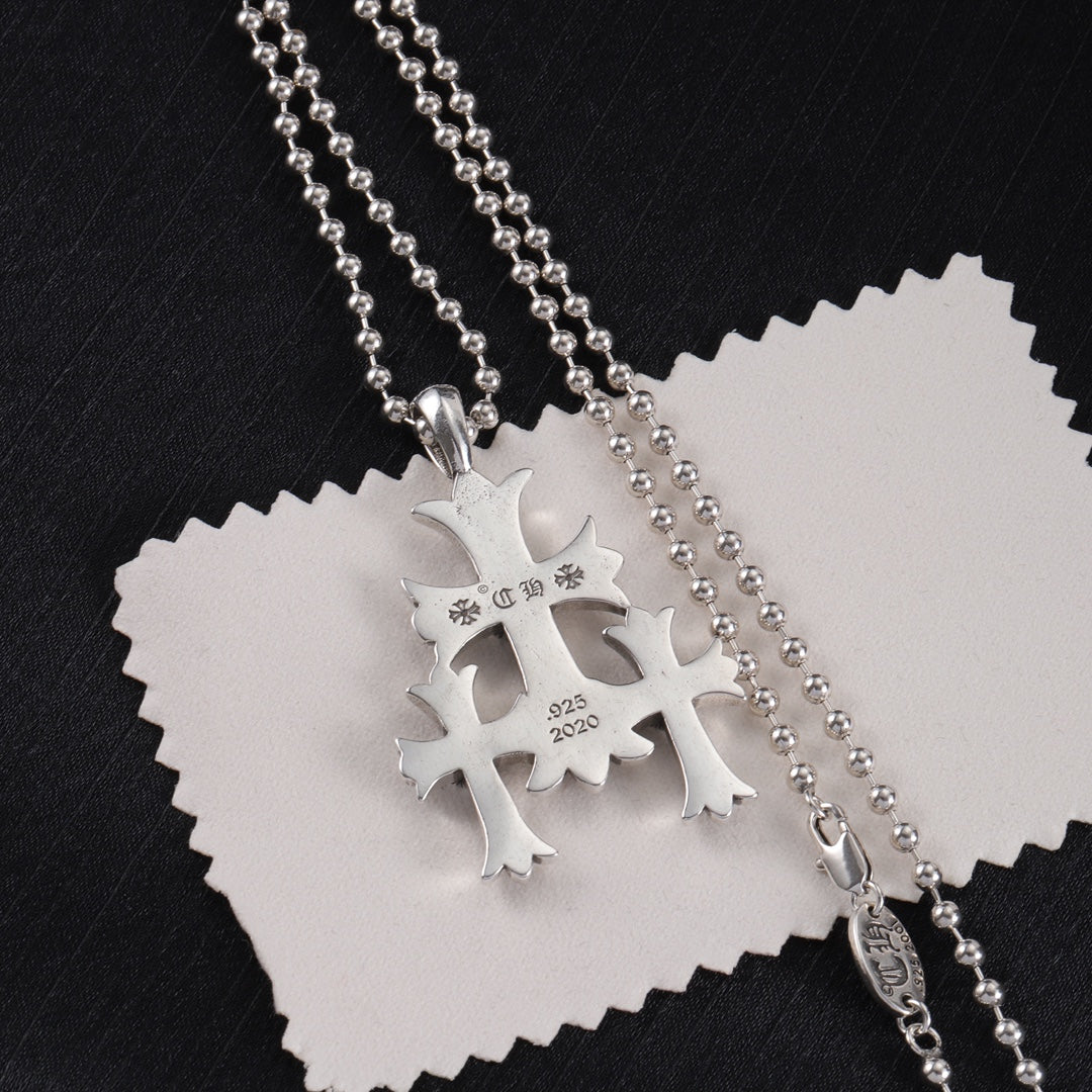 Chrome pendant necklace with snowflake-like charm, engraved 925 and 2020