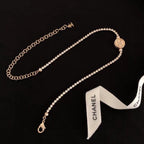 Chanel pearl-bead necklace with round logo pendant and small drop clasp
