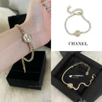 Chanel bracelet on hand with pearl beads and round logo medallion center