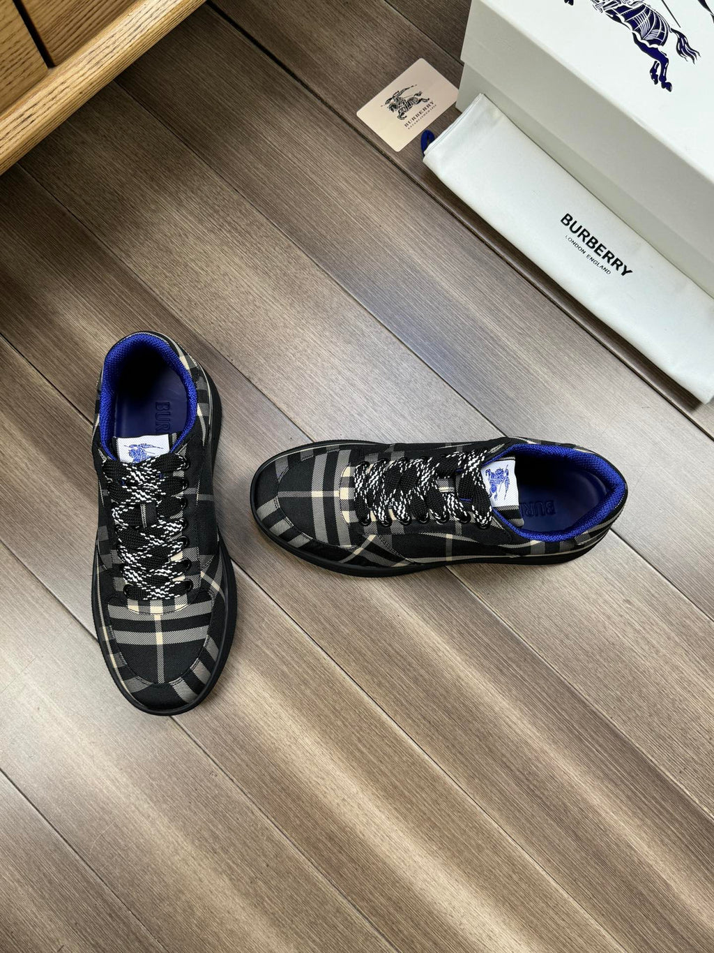 Burberry lace-up sneakers, side view, black check uppers with blue trim
