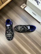 Burberry lace-up sneakers, side view, black check uppers with blue trim