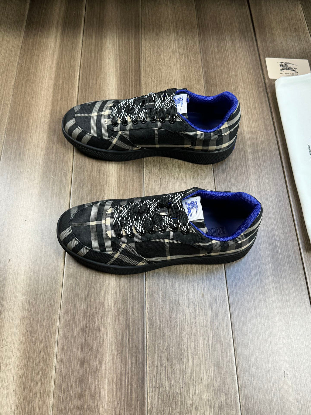 Burberry lace-up sneakers, pair view, black plaid fabric and blue interior