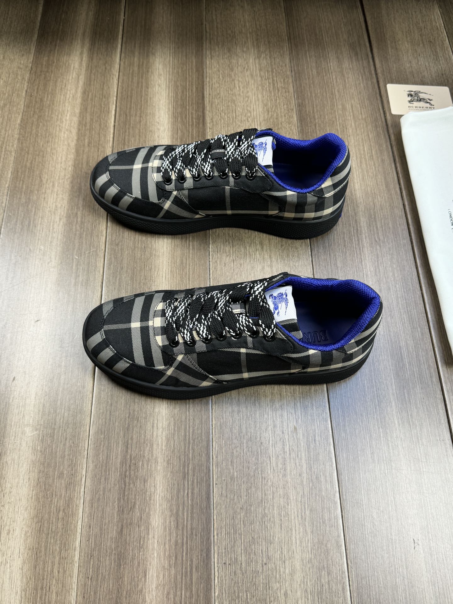 Burberry lace-up sneakers, pair view, black plaid fabric and blue interior