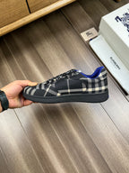 Burberry lace-up sneakers, hand-held side, black plaid upper with blue accents