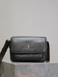 YSL flap crossbody bag in black textured leather, with silver logo on front