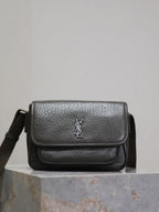 YSL flap crossbody bag in black textured leather, with silver logo on front