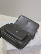 YSL mini crossbody bag with flap open showing textured body and black top panel