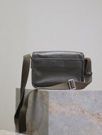 YSL crossbody bag side view with adjustable strap buckle and top stitching