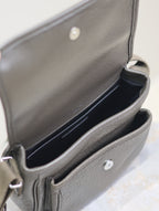 YSL crossbody bag open interior view with dark lining and front slip pocket