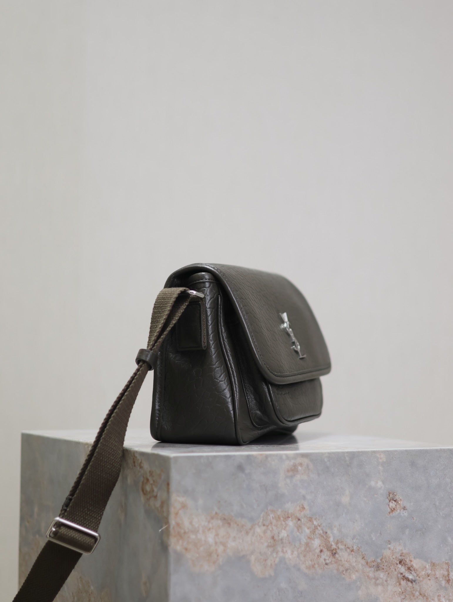 YSL small shoulder bag back/side view in black leather with turn-lock flap