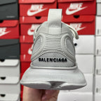 Light gray shoe heel with raised collar and BALENCIAGA logo on back