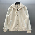 Cream hooded jacket with button front, side pockets, and embroidered Louis Vuitton crest