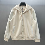 Cream hooded jacket with button front, side pockets, and embroidered Louis Vuitton crest