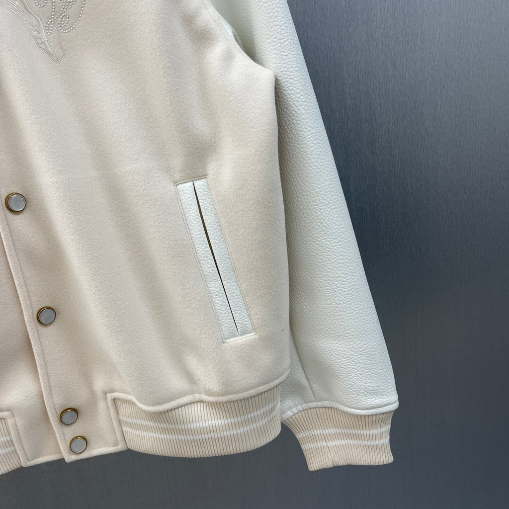 Cream hooded jacket hem and sleeve cuff with ribbing and button placket detail
