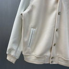 Cream hooded jacket front detail with button placket and chest patch pocket