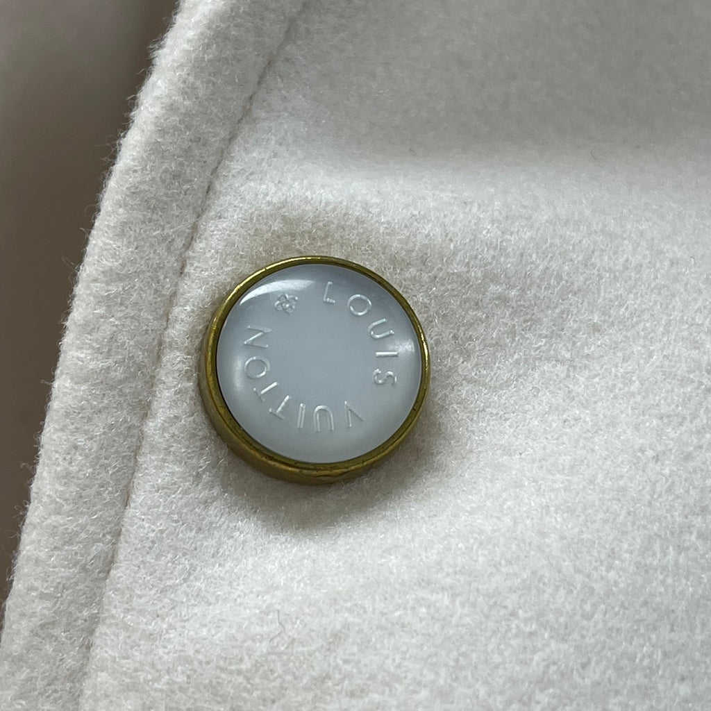 Cream jacket metal snap button with Louis Vuitton engraved circle