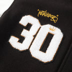 Black varsity jacket with large 30 applique and Metalhead patch detail