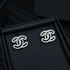 CC logo stud earrings, silver-toned with glossy black enamel