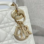 White quilted Dior handbag charm with gold-tone ring and CD monogram plate