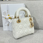 White quilted Dior handbag, top handles and gold-tone chain strap, front angle