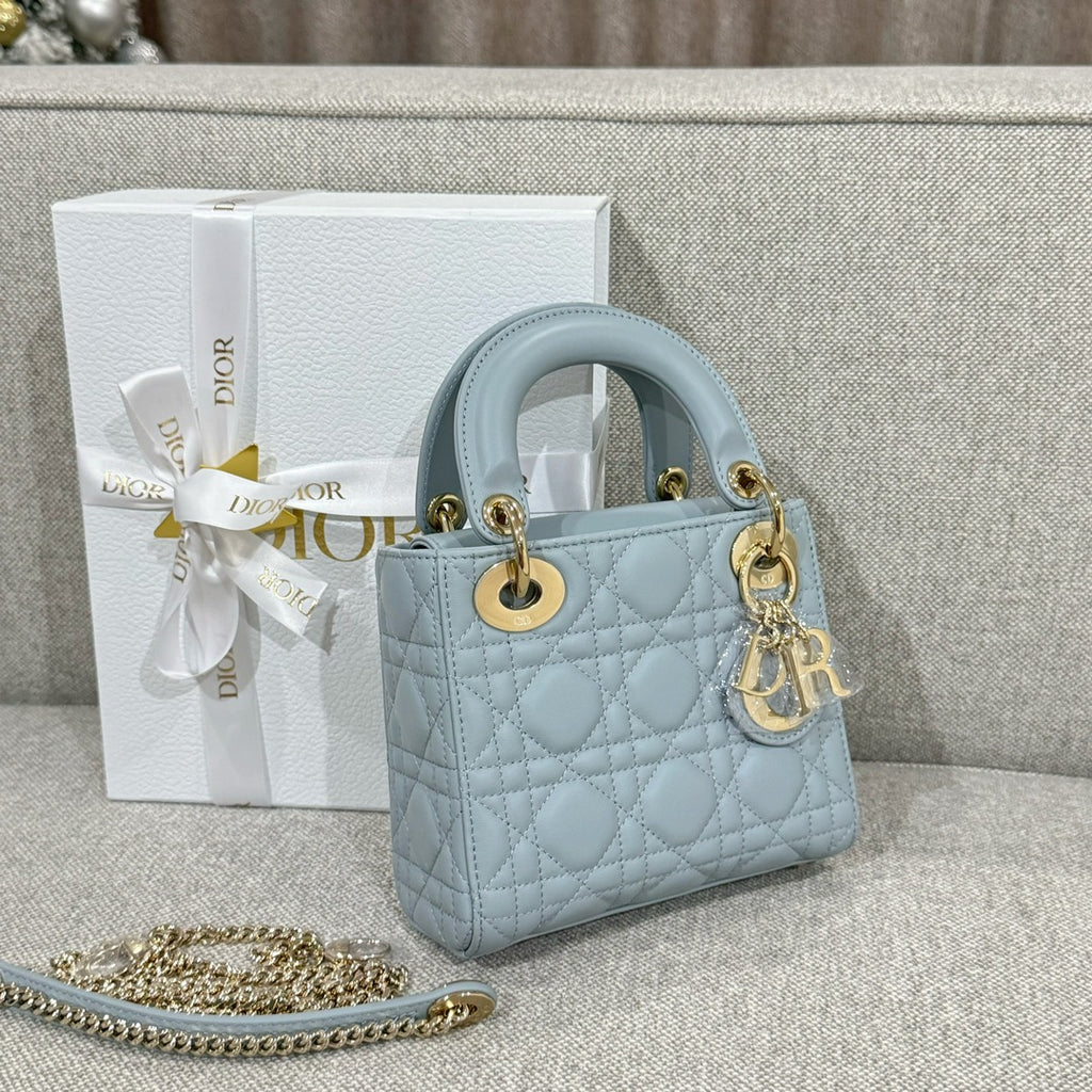 Dior handbag in light blue quilted leather with gold-tone hardware and chain strap