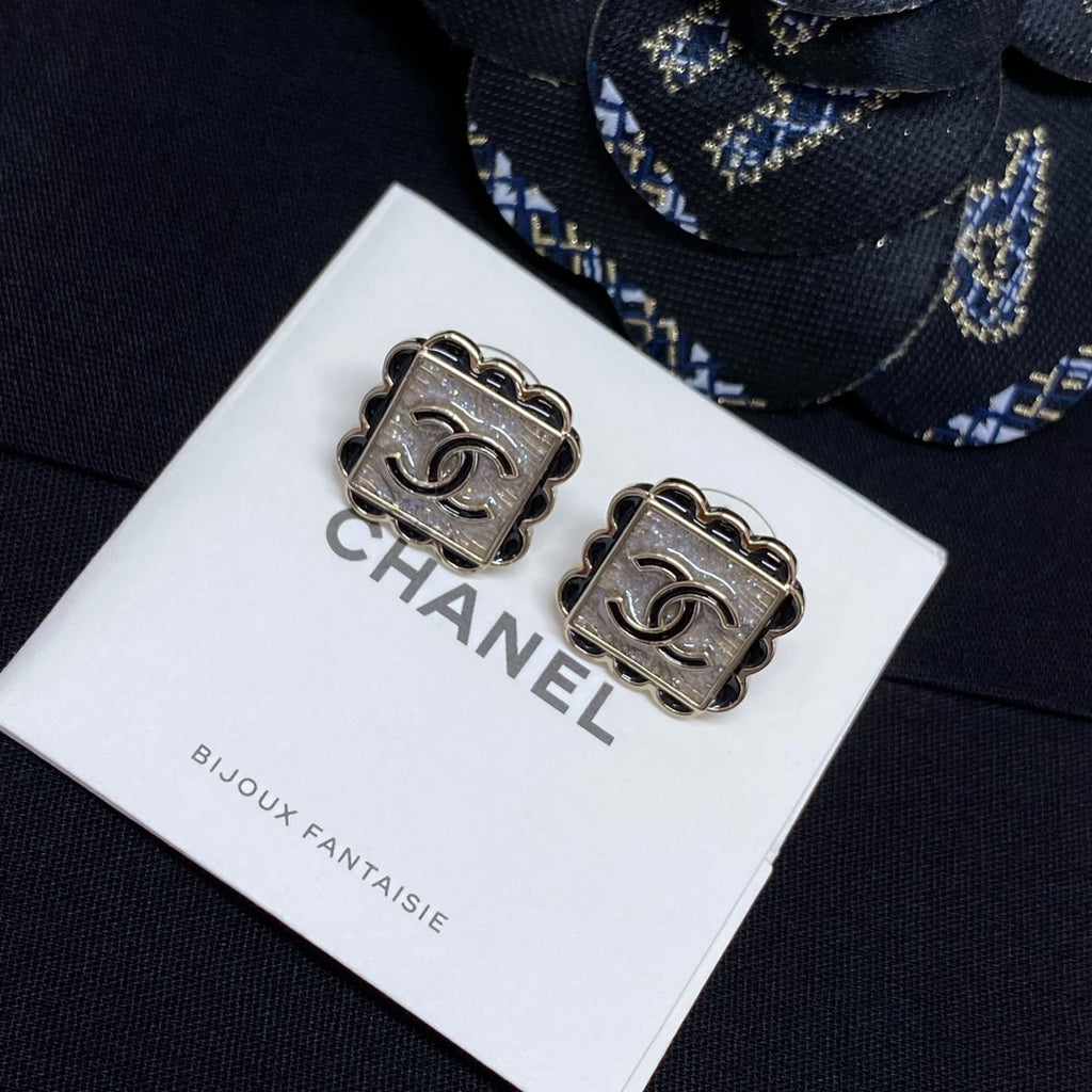 Square stud earrings with silver Chanel logo plaques and scalloped borders